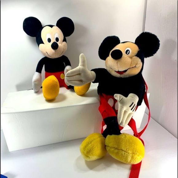 Mickey Mouse backpack and a Mickey Mouse friend.